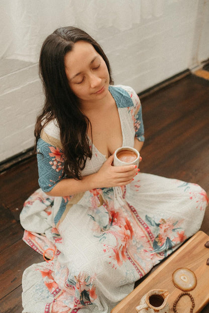 A women enjoying Cacao Drink